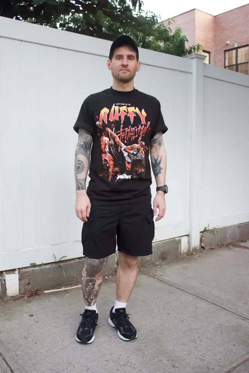 black cargo shorts with black graphic tee